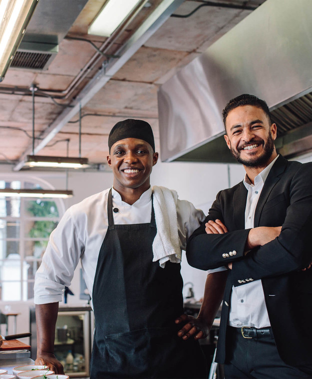 Restaurant Owner and Chef Standing Together