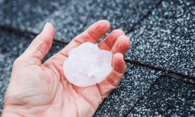 Hand Holding a Large Hailstone