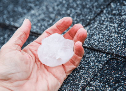 Hand Holding a Large Hailstone