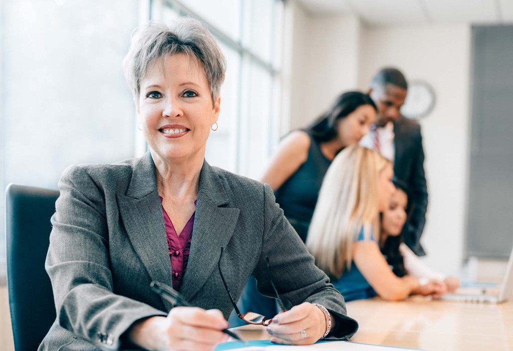 Female Insurance Agent Sitting at a Desk